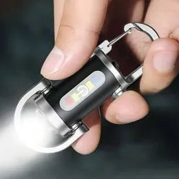 Mini linterna LED COB recargable pegada a superficie metálica
