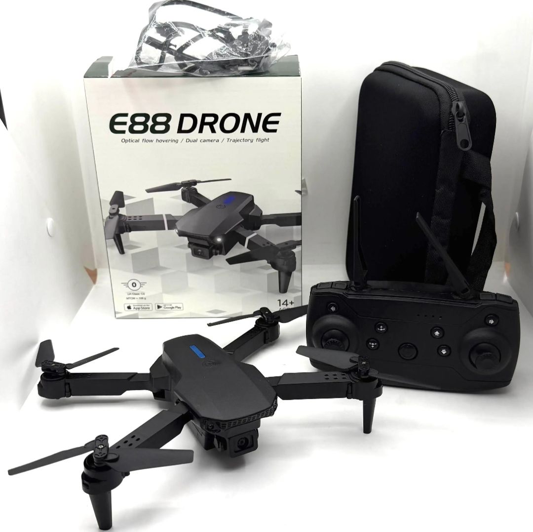 Dron plegable 4K negro desplegado con su mando de control