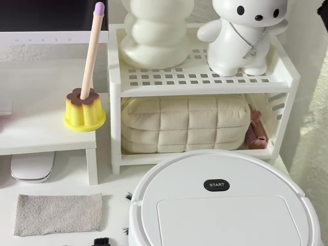 Todo lo que incluye: robot, cable USB, cepillo y pano de trapeado